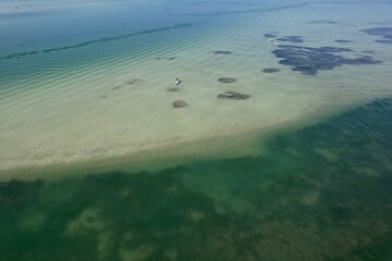 An aerial drone view of Dunedin Causeway beach showing the seagrass at low tide.