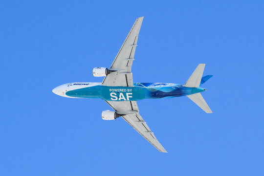 Everett, WA, USA - January 12, 2024; Boeing 777 underside with powered by SAF Sustainable Aviation Fuel text