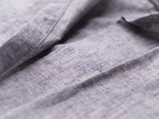 Close up of men's linen shirt. Soft focus.	
