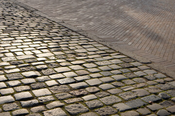 The pavement area is paved with gray large stone texture