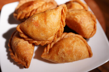 Curry puff snacks Traditional Thai desserts On the wooden table