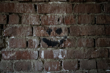 Smiley Face paint on a Brickwall