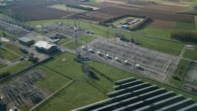 Aerial view of electrical substation near a solar photovoltaic power plant.