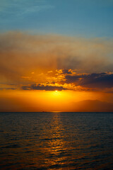 Sunset with Blue Sky and Clouds Portrait at Mediterranean Sea in Thassos, Greece