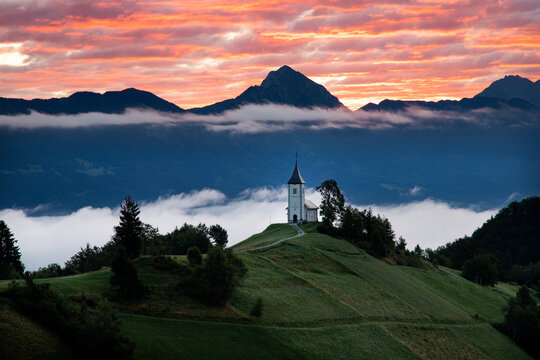 Jamnik, Slovenia - Magical foggy summer sunrise at Jamnik St.Primoz church.