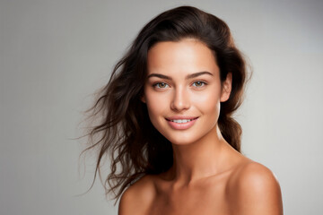 Fototapeta premium Portrait of a young woman with flawless skin and a subtle smile