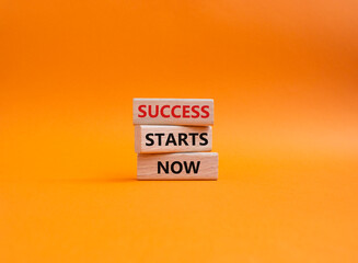 Success Starts Now symbol. Concept words Success Starts Now on wooden blocks. Beautiful orange background. Psychological social and Success Starts Now concept. Copy space.