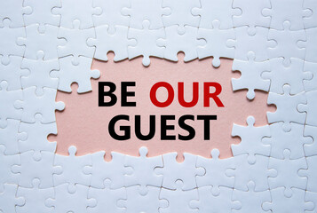 Be our guest symbol. Concept words Be our guest on white puzzle. Beautiful pink background. Business and Be our guest concept. Copy space