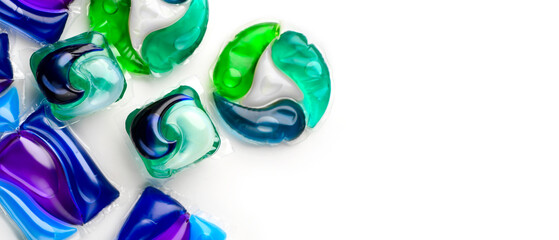 Washing capsules, colorful laundry pods border design. Colorful Soluble capsules with laundry gel detergent and dishwasher soap. Pile of washing pod capsules isolated. Detergent tablets. Top View - 708679782