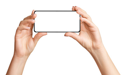 Women's hands hold the phone horizontally. On an empty background.