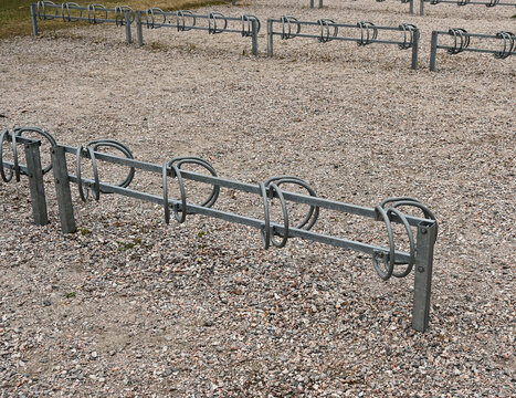 bicycle parking on a dirt area