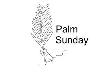 A person's hand holds a palm leaf