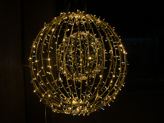 Close-up large round LED glowing ball isolated on black background