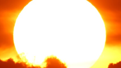 African sunset time lapse with big sun disk and backlit clouds. Cinematic and epic hot summer...