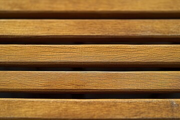 A detailed shot of a wooden bench. Ideal for adding a rustic touch to any outdoor setting