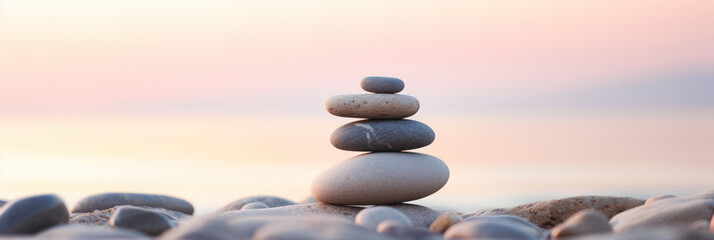 Zen stone tower with peaceful sea and sky bokeh