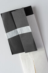 black and white paper with masking tape