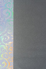 iridescent rainbow floral swirls and blank dark gray paper (suitable for copy)