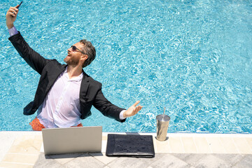 Summer freelance business. Freelancer on summer sea beach. Crazy freelancer in suit in sea water....