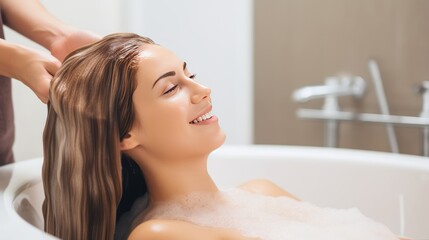 Pleasured young woman enjoys head massage taking foamy bath in cosmetology salon - obrazy, fototapety, plakaty