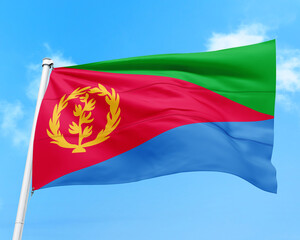 Eritrea flag fluttering in the wind on sky.
