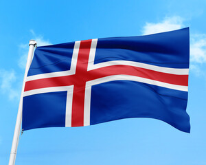 Fototapeta premium Iceland flag fluttering in the wind on sky.