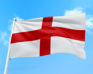 England flag fluttering in the wind on sky.