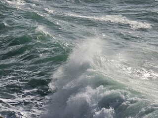 Corniglia, 5 Terre, Italy - January 05, 2024: Beautiful photography of the Cinque Terre landscape. Spectacular  view of the waves with blue sky in the background in winter days. 