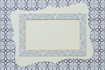 cardboard frame on blank card with curvy edges and decorative quatrefoil patterned scrapbooking paper