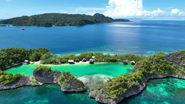 Rufas Island is fringed by beautiful coral reefs in Raja Ampat, Indonesia. This region is known for its exquisite coral reefs and overall high marine biodiversity.
