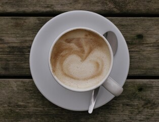 cup of coffee on wooden table