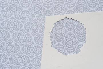 roundish paper die-cut shape frame on holiday scrapbooking paper sheets