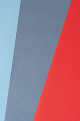 blue, gray, and red paper background with stripe element