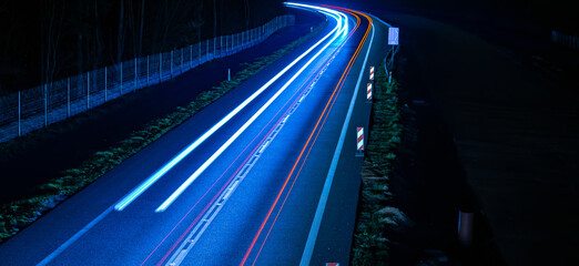 lights of cars driving at night. long exposure