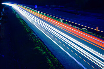 lights of cars driving at night. long exposure