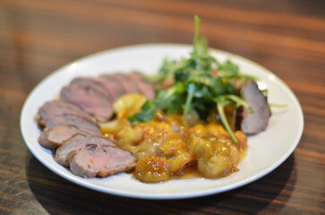 rosemary duck breast steak with vegetables and caramelized fruit