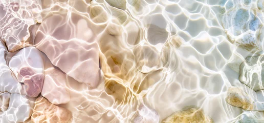 Deurstickers White stones with sun lights shadow in clear ripple water. Sea stones in the sea water. Pebbles under water. top view. abstract spa background concept banner for cosmetic care product.  © Viks_jin