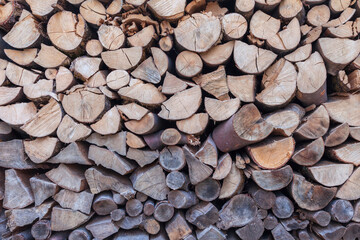 Dried chopped stacked firewood logs