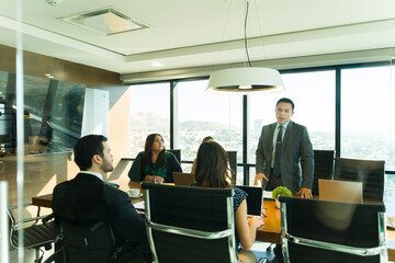 Male attorney talking during a business meeting with some clients