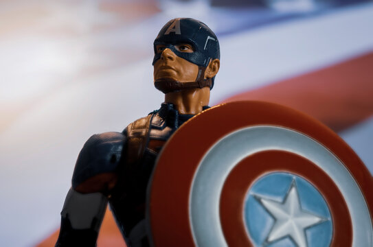 NEW YORK USA: AUGUST 7 2020: Portrait of Marvel comic superhero Captain America of the Avengers with USA flag - Hasbro action figure