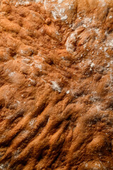 Cake on the table on parchment paper. Cooling the cake and preparing to decorate