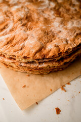 Preparing cakes for decoration with marshmallow , berries, and candied fruits, powdered sugar