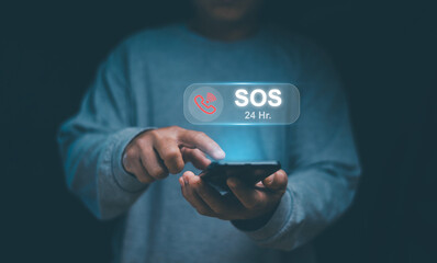 Emergency signal requesting help call concept. Human hand touching icon SOS emergency app on mobile...