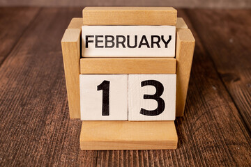 February 13th. Day 13 of month, calendar on designer workplace background. Winter time. Empty space for text