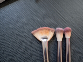 Makeup brushes on a black background. Make-up brushes.