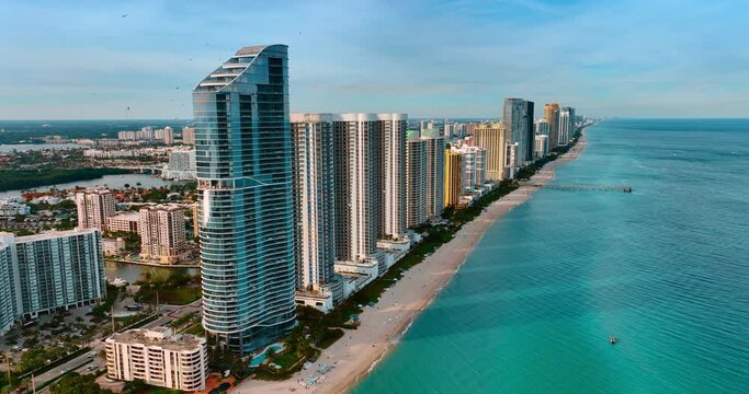 Beautiful high-rise apartment blocks built in row on the shore of the Atlantic Ocean. Miami beach panorama from top.