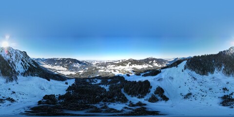 Aerial view on the mountain with the ski lifts on a beautiful winter sunny day.  Jungholz, Tirol,...