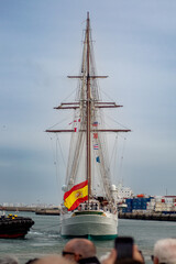 Juan Sebastian de Elcano sailing ship undocking from Cadiz harbor
