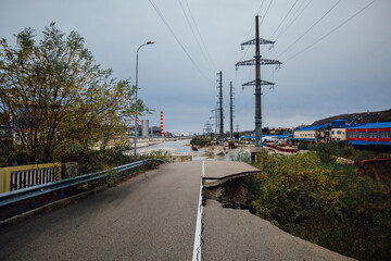 Fototapeta na wymiar Damaged concrete bridge over mountain river in Tuapse. Consequences of flood
