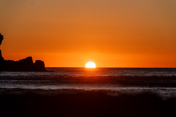 Sunset at Piha, West Auckland, Auckland region of New Zealand. January 12, 2024 - 8
